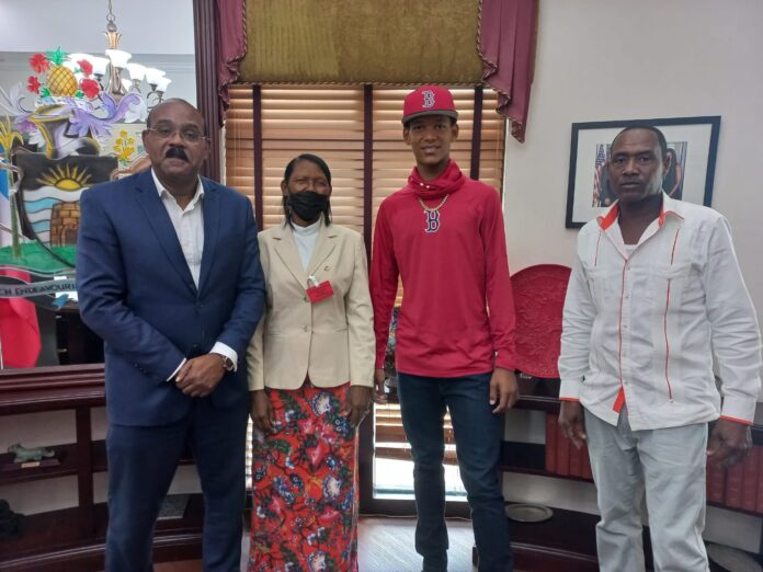 PM Browne meets with young Antiguan who plays baseball for Boston Red Sox